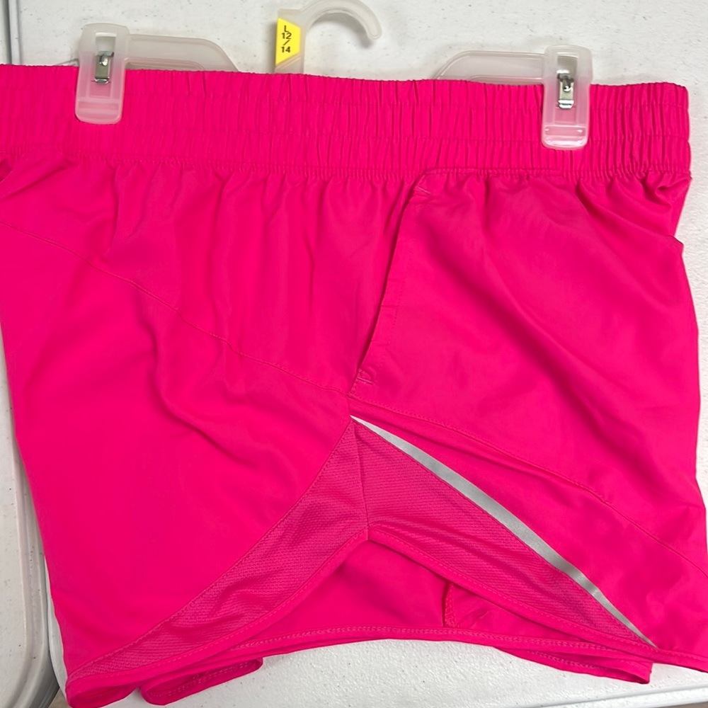 New Pink athletic running shorts.